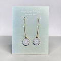 Harlow Mae Designs LLC delicate gold-tone hoop earrings with black and white patterned circular charms.