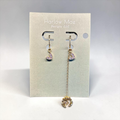 Harlow Mae Designs LLC asymmetrical gold-tone drop earrings with heart charms and cubic zirconia stones.