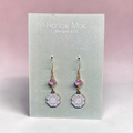 Harlow Mae Designs LLC dangle earrings with pink cubic zirconia and white enamel charms featuring traditional patterns.