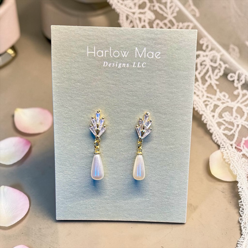 Harlow Mae Designs LLC teardrop pearl drop earrings with crystal accents. Gold-tone finish.