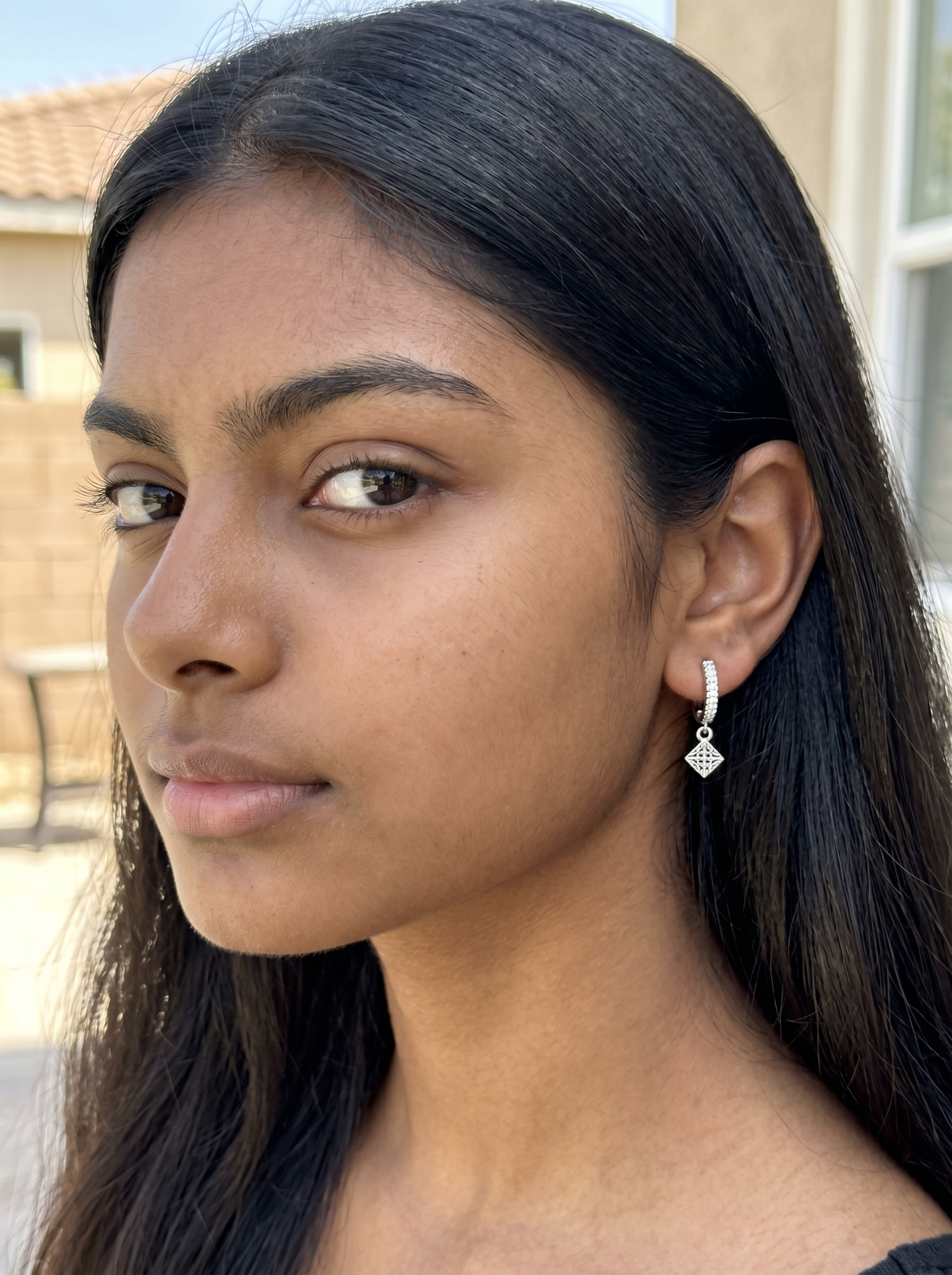 Harlow Mae sterling silver hoop earrings with pave cubic zirconia and a diamond-shaped charm.
