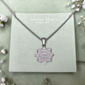 Harlow Mae Designs LLC silver-tone floral pendant necklace with intricate swirls and heart shapes on a box chain.