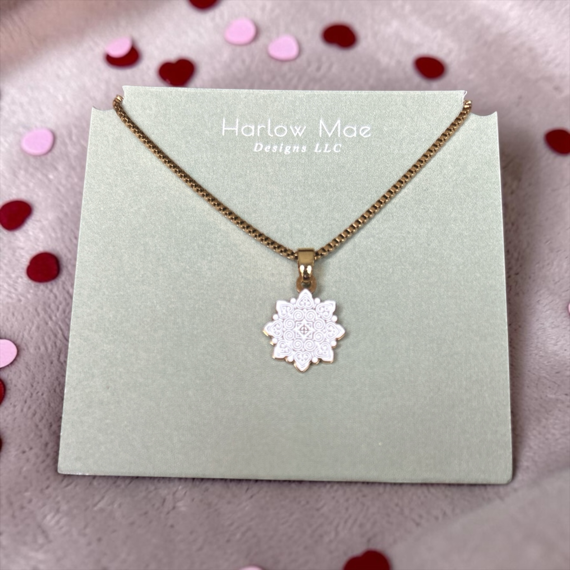 Harlow Mae white mandala pendant necklace with rose gold chain and intricate detailing. Delicate and elegant.