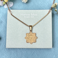 Harlow Mae Designs LLC rose gold-plated necklace with an intricate eight-pointed star pendant featuring swirling hearts and geometric patterns.