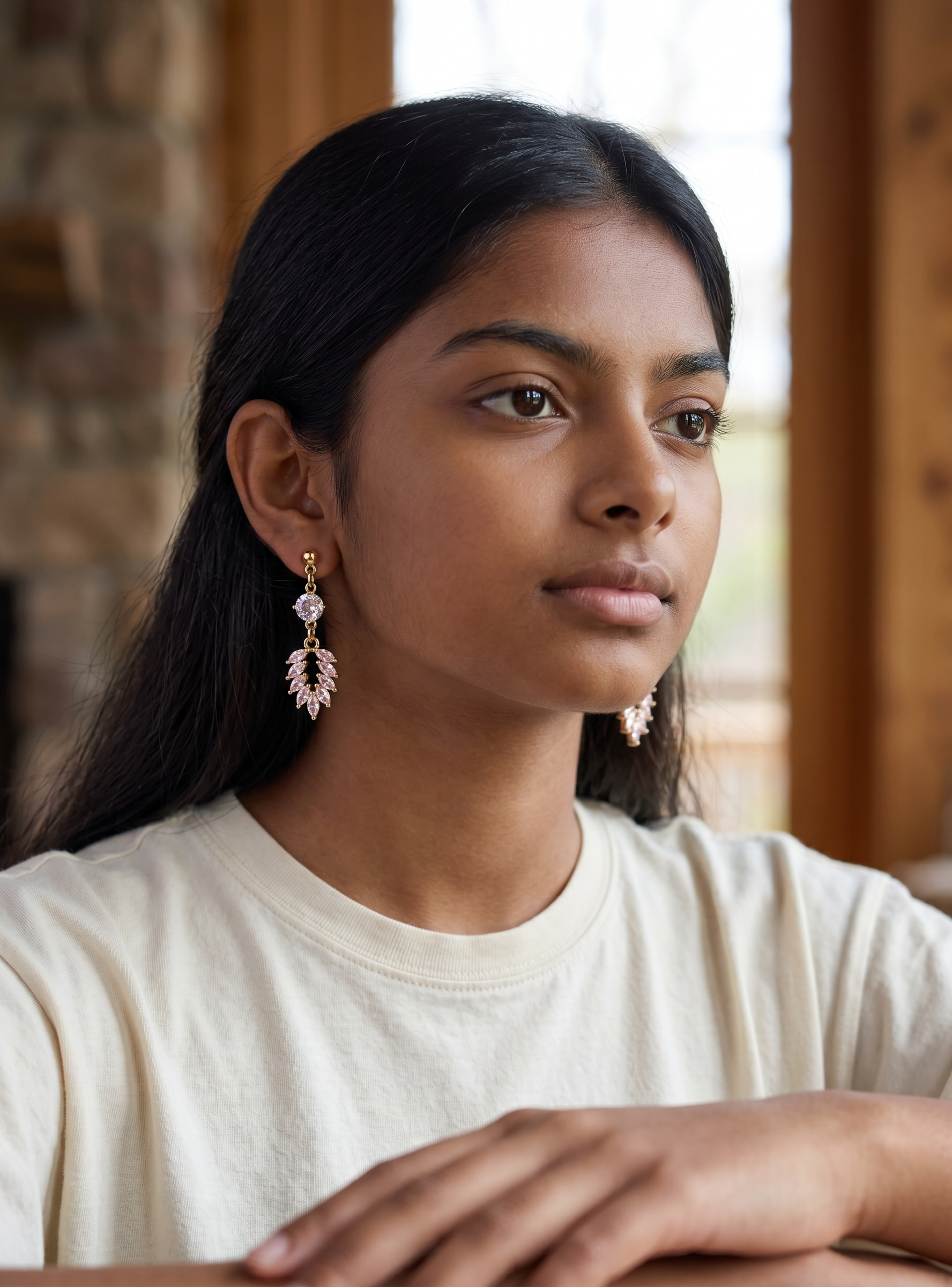 Harlow Mae rose gold-tone drop earrings with clear and pink cubic zirconia stones in a leaf design.