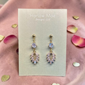 Harlow Mae rose gold-tone drop earrings with clear and pink cubic zirconia stones in a leaf design.