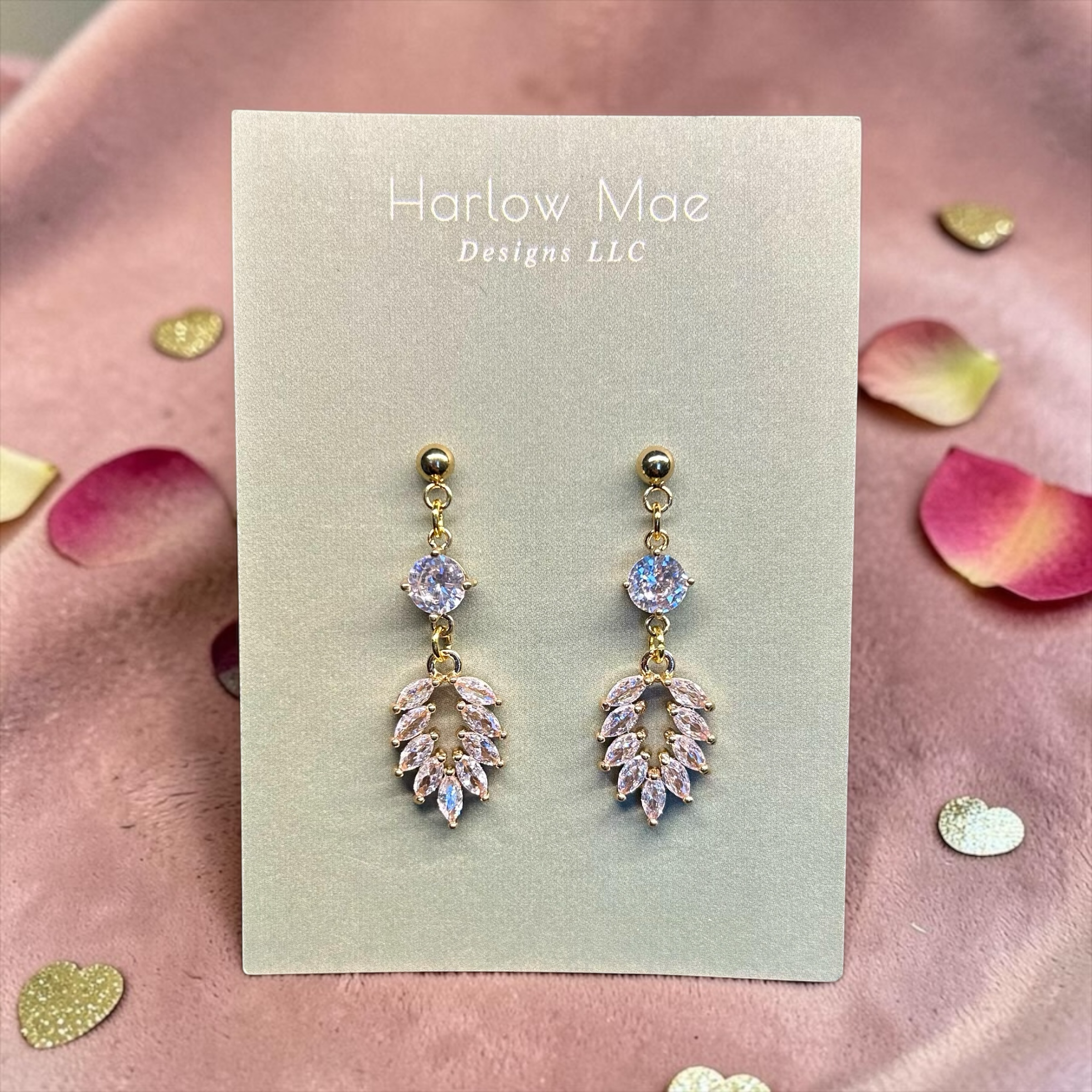 Harlow Mae rose gold-tone drop earrings with clear and pink cubic zirconia stones in a leaf design.