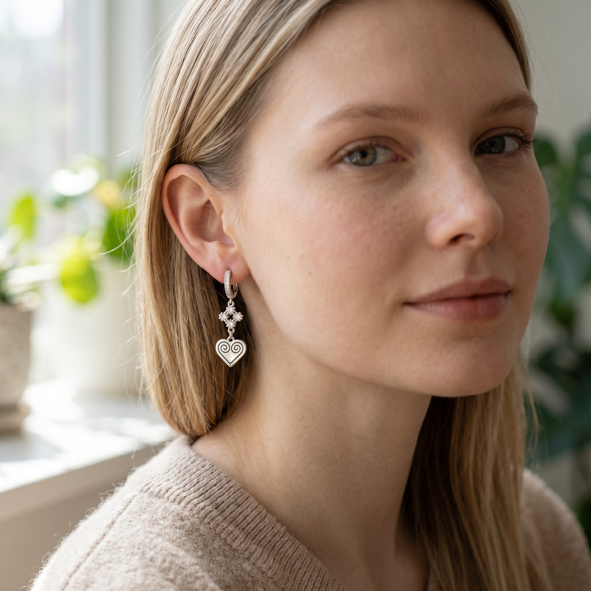 Harlow Mae silver-tone dangle earrings with cubic zirconia clover top and spiral heart pendant.